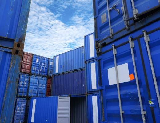 Container logistic. Cargo and shipping business. Container ship for import and export logistic. Container freight station. Logistic industry from port to port. Container at harbor for truck transport.